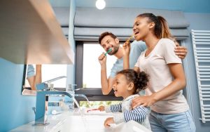 family practicing oral hygiene habit